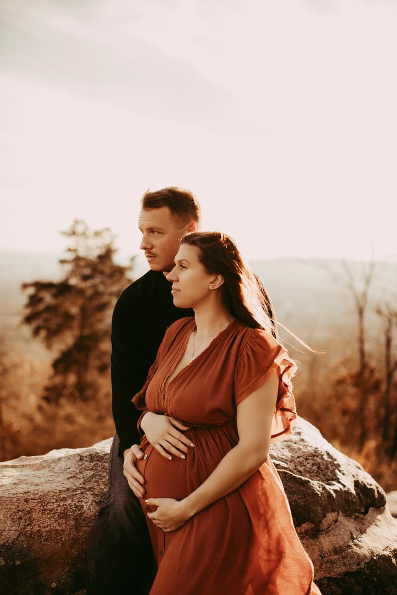 Golden Hour Maternity - couple looking out over mountain overlook