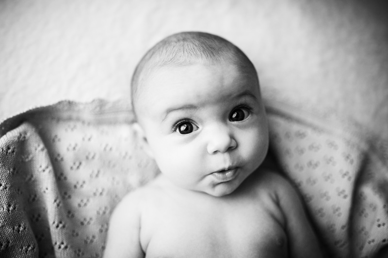 head shot of a baby girl with puckered lips